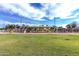 A spacious playground with a variety of play equipment and ample green space at 632 W Natal Cir, Mesa, AZ 85210