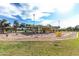 A charming playground with swings, slides, and other play equipment under a shaded structure at 632 W Natal Cir, Mesa, AZ 85210