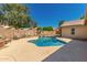Beautiful backyard pool surrounded by desert landscaping, perfect for relaxing or entertaining at 632 W Natal Cir, Mesa, AZ 85210