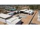 Aerial view shows home construction, a future pool, with other neighborhood amenities in the background at 7001 E Paradise Dr, Scottsdale, AZ 85254