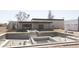 Backyard view featuring a modern pool under construction, with steps leading to the main house, promoting outdoor enjoyment at 7001 E Paradise Dr, Scottsdale, AZ 85254