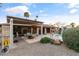 Spacious backyard featuring a covered patio, dining area, pool, mature landscaping, and a charming desert vibe at 7240 W Grovers Ave, Glendale, AZ 85308