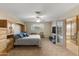 Spacious main bedroom with built-in cabinets and an ensuite bathroom at 7240 W Grovers Ave, Glendale, AZ 85308