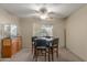 Cozy dining area with classic ceiling fan and view to the outside at 7240 W Grovers Ave, Glendale, AZ 85308
