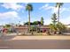 Charming ranch-style home with desert landscaping, mature palm trees, and an inviting front yard at 7240 W Grovers Ave, Glendale, AZ 85308