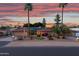 Beautiful single story home with desert landscaping and blue sky with an American flag waving at 7240 W Grovers Ave, Glendale, AZ 85308