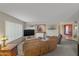 Relaxing living room with neutral tones, ship decor, and lots of light at 7240 W Grovers Ave, Glendale, AZ 85308