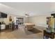 Open living area with a billiard table, mini bar and tile entryway at 7240 W Grovers Ave, Glendale, AZ 85308