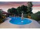 Large backyard with a swimming pool, outdoor kitchen area, and manicured landscaping at 7240 W Grovers Ave, Glendale, AZ 85308