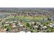 Overhead shot of the community with a golf course, lake, and well-manicured landscaping at 7552 N San Manuel Rd, Scottsdale, AZ 85258