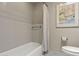 Neutral tones highlight this bathroom with a shower and tub combination at 7552 N San Manuel Rd, Scottsdale, AZ 85258
