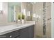 Well-lit bathroom featuring modern vanity, glass shower, and contemporary design elements at 7552 N San Manuel Rd, Scottsdale, AZ 85258