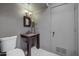 Functional powder room with a stylish vanity, decorative mirror, and neutral color scheme at 7552 N San Manuel Rd, Scottsdale, AZ 85258