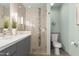Bathroom featuring a glass shower and modern vanity, creating a sleek aesthetic at 7552 N San Manuel Rd, Scottsdale, AZ 85258