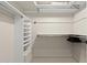 Walk-in closet with built-in shelving and ample storage space for organization at 7552 N San Manuel Rd, Scottsdale, AZ 85258