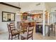 Open dining area with wood accents that seamlessly connects to a well-appointed kitchen at 7552 N San Manuel Rd, Scottsdale, AZ 85258