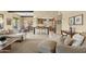 Spacious living room with an open layout connecting to the dining area and kitchen for easy entertaining at 7552 N San Manuel Rd, Scottsdale, AZ 85258