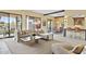 Open-concept living room featuring a large sectional sofa, natural light, and seamless access to the dining area at 7552 N San Manuel Rd, Scottsdale, AZ 85258