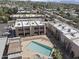 Aerial view of a townhome community featuring a pool and desert landscaping at 811 W 13Th St, Tempe, AZ 85281