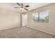 Bright bedroom featuring neutral carpet, ceiling fan, and natural light at 811 W 13Th St, Tempe, AZ 85281