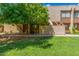 Inviting townhome featuring mature trees and a well-manicured lawn at 811 W 13Th St, Tempe, AZ 85281
