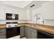 Well-lit kitchen with two-tone cabinets and modern appliances at 811 W 13Th St, Tempe, AZ 85281