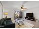 Spacious living room with ceiling fan and sliding glass door to the outside patio at 811 W 13Th St, Tempe, AZ 85281