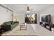 Bright living room with modern furniture, ceiling fan, and access to a patio at 811 W 13Th St, Tempe, AZ 85281