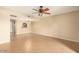 Bright living room with tile floors, open to dining area with breakfast bar, and neutral color scheme at 811 W 13Th St, Tempe, AZ 85281