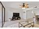 Bright living room with neutral tones, ceiling fan, and view to exterior patio at 811 W 13Th St, Tempe, AZ 85281