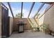 Private outdoor patio space with grill, seating and open ceiling at 811 W 13Th St, Tempe, AZ 85281