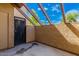 Private patio with a partial pergola for shade, offering an intimate outdoor space with secure metal gate at 811 W 13Th St, Tempe, AZ 85281
