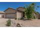View of the front yard with rock accents, mature landscaping, and a well-maintained exterior at 829 S Roanoke St, Gilbert, AZ 85296