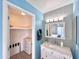 Modern bathroom with closet, vanity and well-lit mirror at 850 S River Dr # 1085, Tempe, AZ 85281