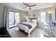 Bright bedroom with a ceiling fan and sliding glass door to a patio at 850 S River Dr # 1085, Tempe, AZ 85281