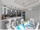 Open kitchen with island and stylish lighting, leading to a dining area at 850 S River Dr # 1085, Tempe, AZ 85281