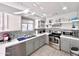 Well-lit kitchen with modern appliances, gray cabinets, and stylish backsplash at 850 S River Dr # 1085, Tempe, AZ 85281