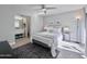 Bright bedroom with a large bed, ensuite bathroom, and access to an outdoor patio at 850 S River Dr # 1085, Tempe, AZ 85281