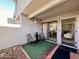 Cozy outdoor patio featuring seating, greenery, and sliding glass door entrance at 850 S River Dr # 1085, Tempe, AZ 85281