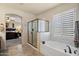 Beautiful bathroom featuring a walk-in shower, a tub, and natural lighting at 8733 E Jacaranda St, Mesa, AZ 85207