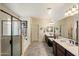 Large primary bathroom boasts dual sinks, a soaking tub, and a walk-in shower at 8733 E Jacaranda St, Mesa, AZ 85207