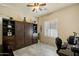 This bedroom features a Murphy bed, a ceiling fan and lots of storage space at 8733 E Jacaranda St, Mesa, AZ 85207