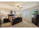 Comfortable bedroom with an accent wall, a window with shutters, and neutral decor at 8733 E Jacaranda St, Mesa, AZ 85207