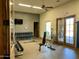 Weight room with dumbbells, weight bench, and mirrors at 8733 E Jacaranda St, Mesa, AZ 85207