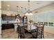 Eat-in kitchen with views of the backyard, featuring a decorative chandelier at 8733 E Jacaranda St, Mesa, AZ 85207