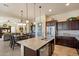 Beautiful kitchen with a large island, stainless appliances, and a walk-in pantry at 8733 E Jacaranda St, Mesa, AZ 85207