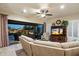 The living room includes patio access and built-in media center and entertainment options at 8733 E Jacaranda St, Mesa, AZ 85207