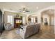 Living room with neutral furniture, built-in media center and convenient access to other spaces at 8733 E Jacaranda St, Mesa, AZ 85207