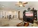 Upstairs living room with plush carpeting and an entertainment center at 8733 E Jacaranda St, Mesa, AZ 85207