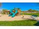Community playground with slide, swings, and covered picnic area at 8733 E Jacaranda St, Mesa, AZ 85207
